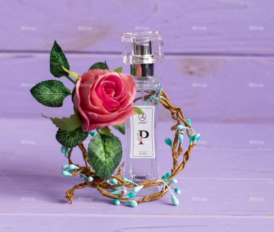 Aesthetic photo of parfum with floral decor