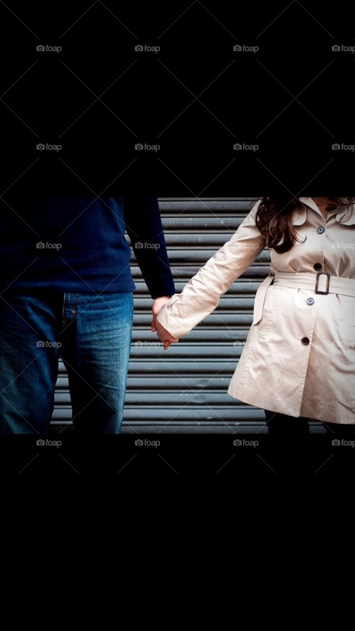 Couple holding hands