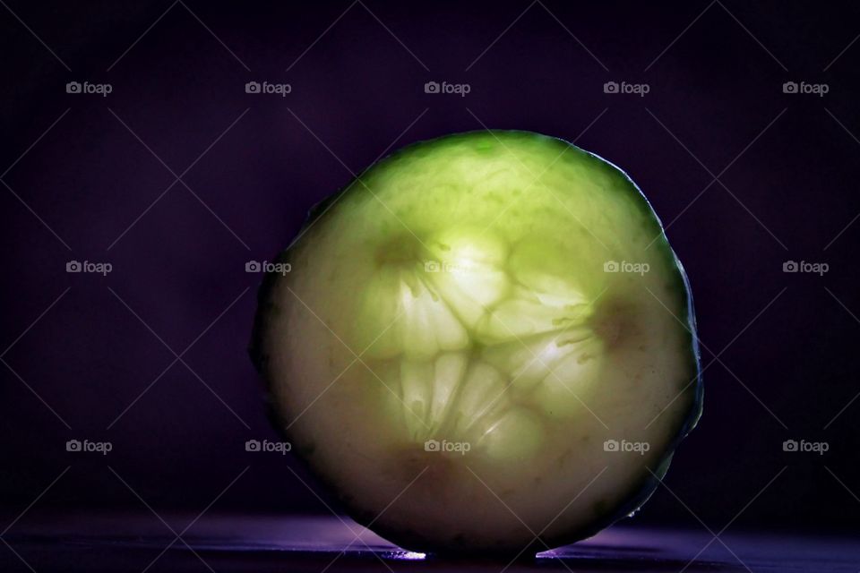 Backlit cucumber slice