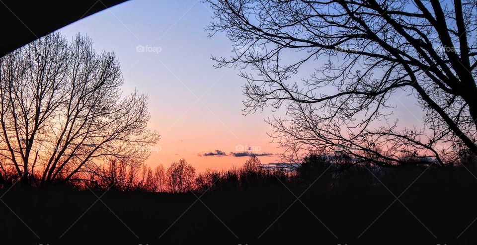 view of a distant landscape after sundown