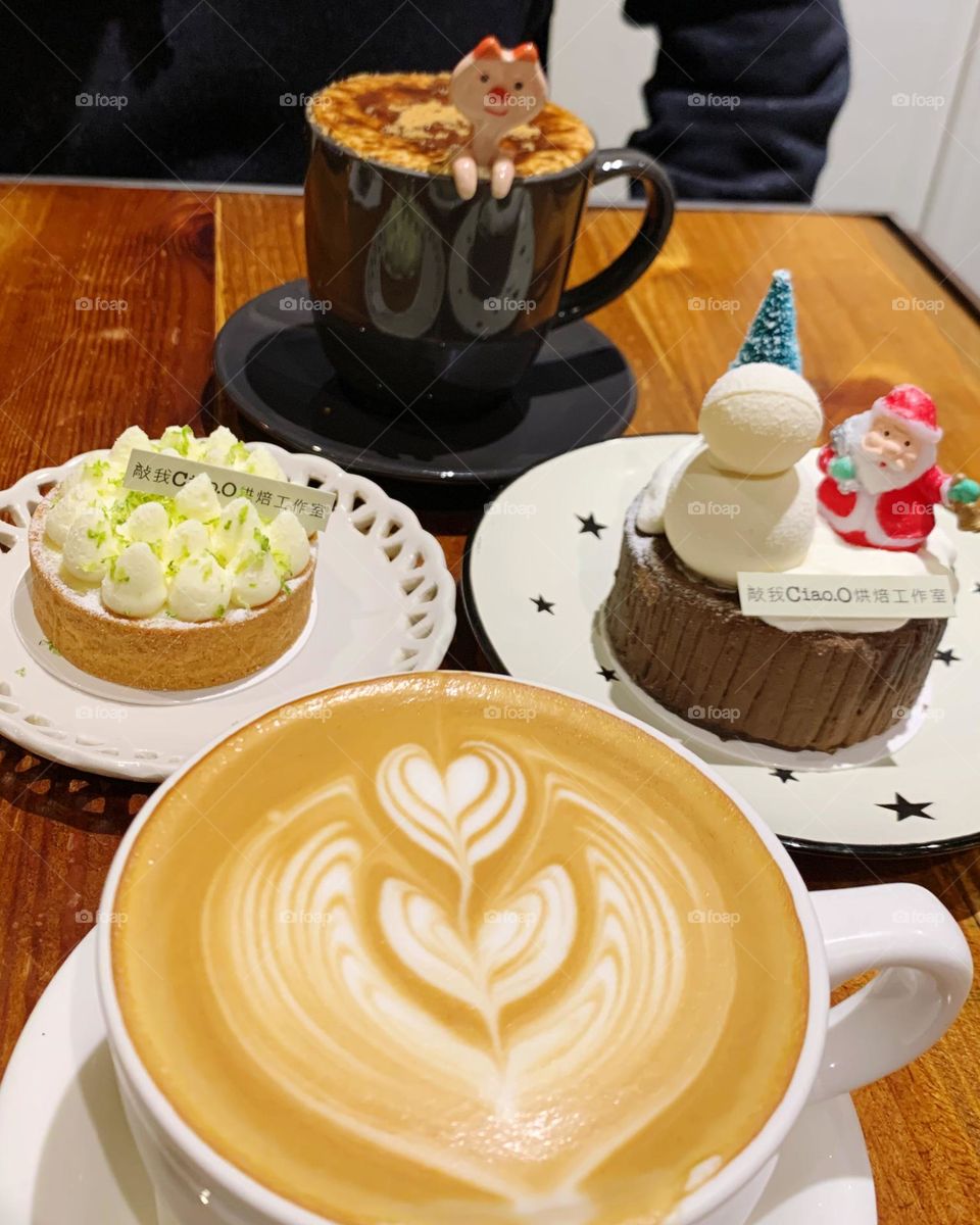 Warm latte coffee with cakes