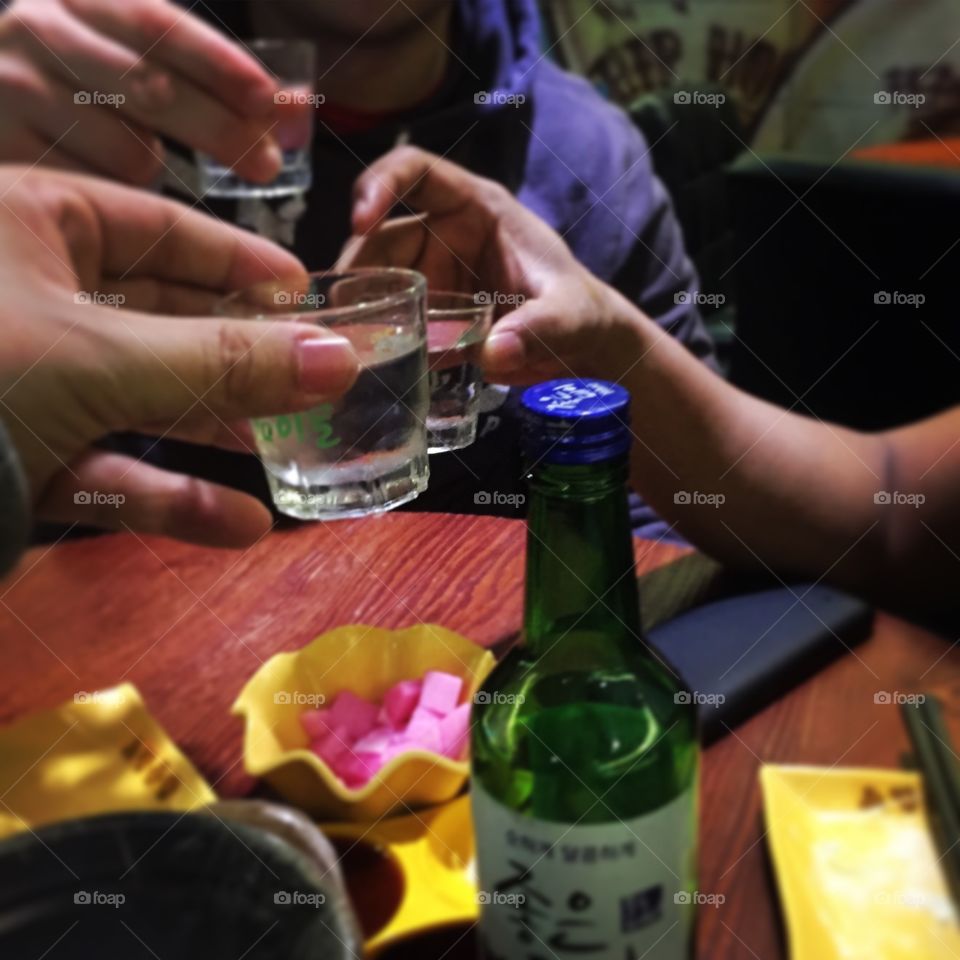 Cheers with the blueberry Soju