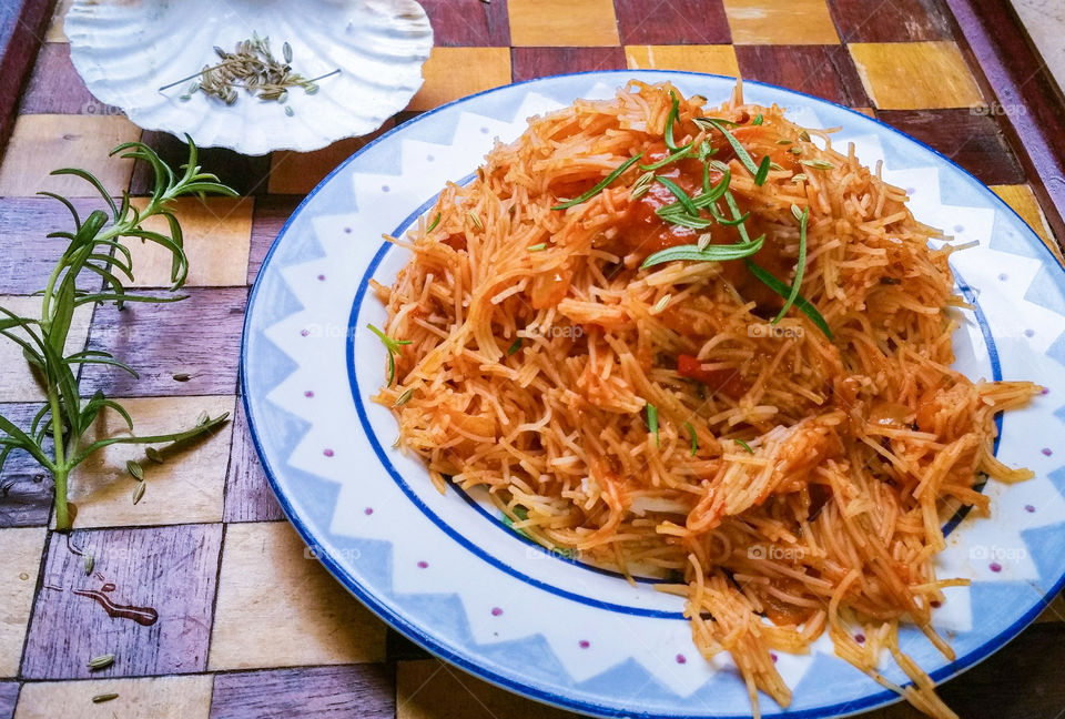 Close-up of vermicelli with tomato pasta sauce
