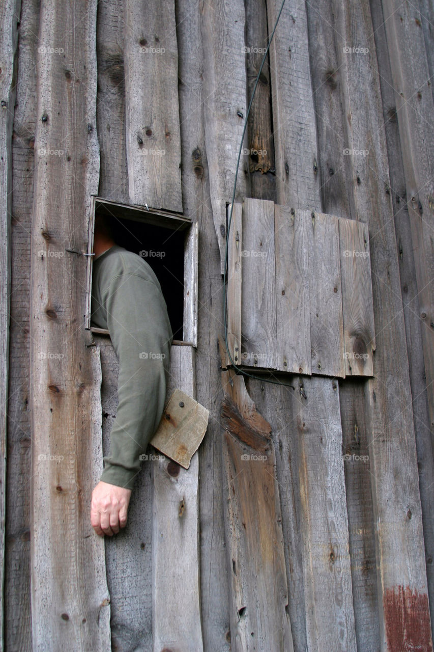 Arm hanging out a window.