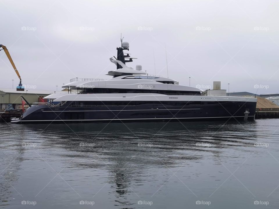 Superyacht Elandess mooring in Poole Harbour. Build by Abeking & Rasmussen Germany, launched in 2018. She is 74.50 metres in length and has a beam of 12.8 feet. Gross tonnage of 2,065 tonnes. Top speed of 17.00 kn and a cruising speed of 14.00 kn