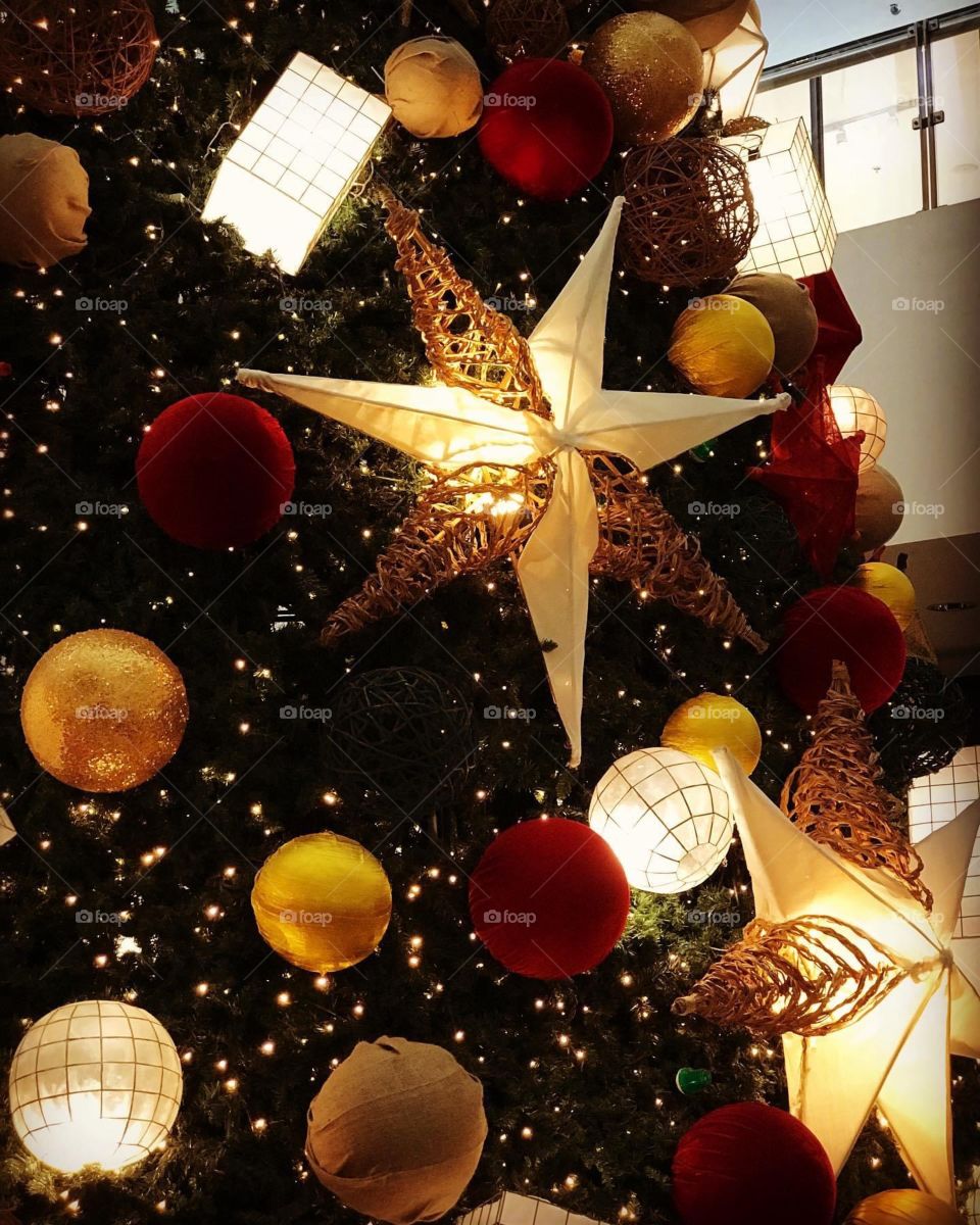 Star as Christmas decor in a sea of colorful balls