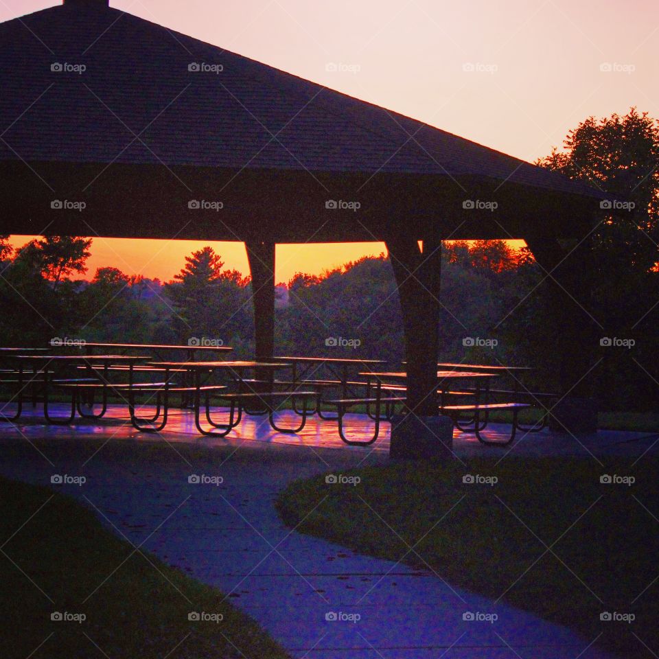 Silhouette of shed during sunset