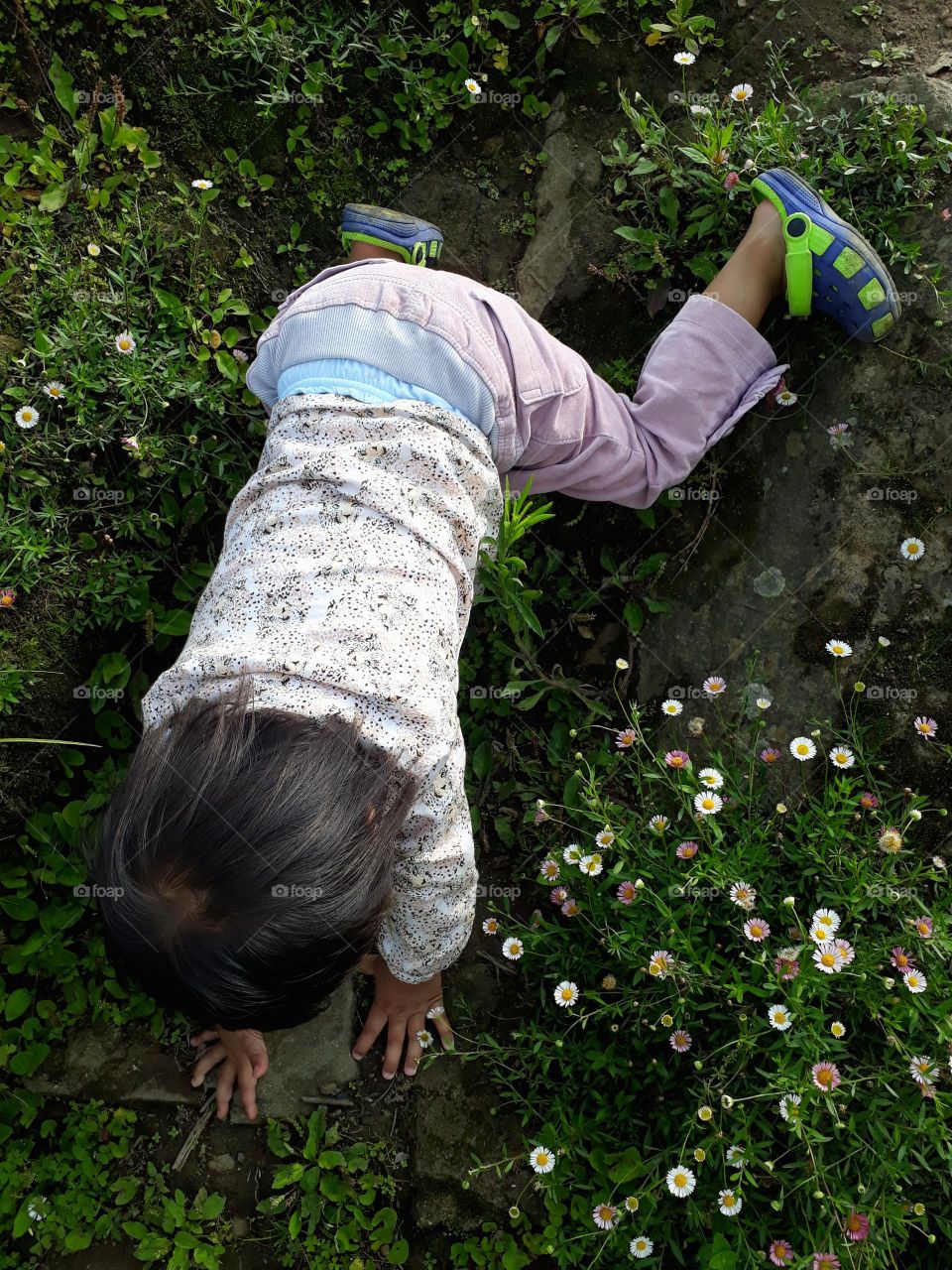 little girl exploring and enjoying the spring season