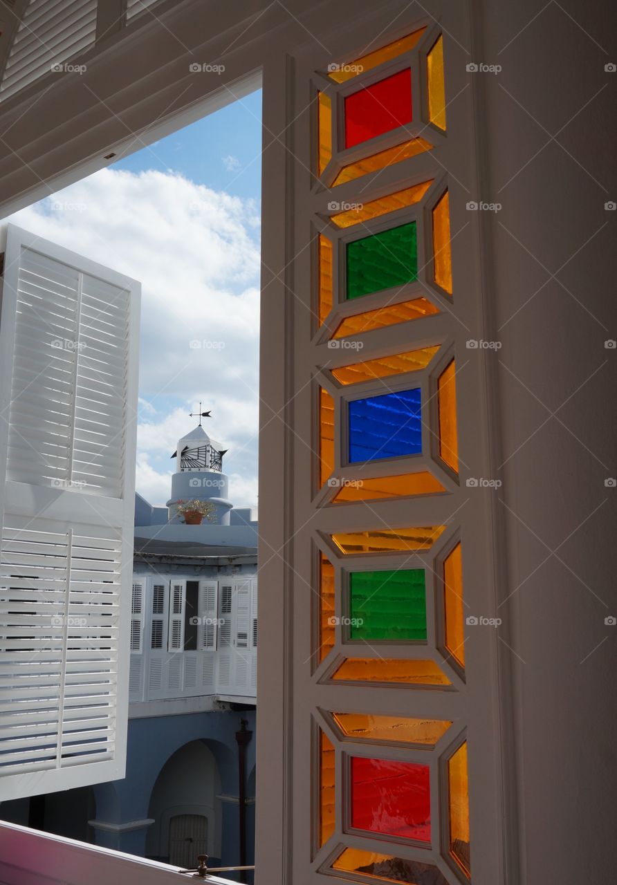 Colorful window panes. Open window flanked by colorful window panes.  Photo taken in San Juan PR. 