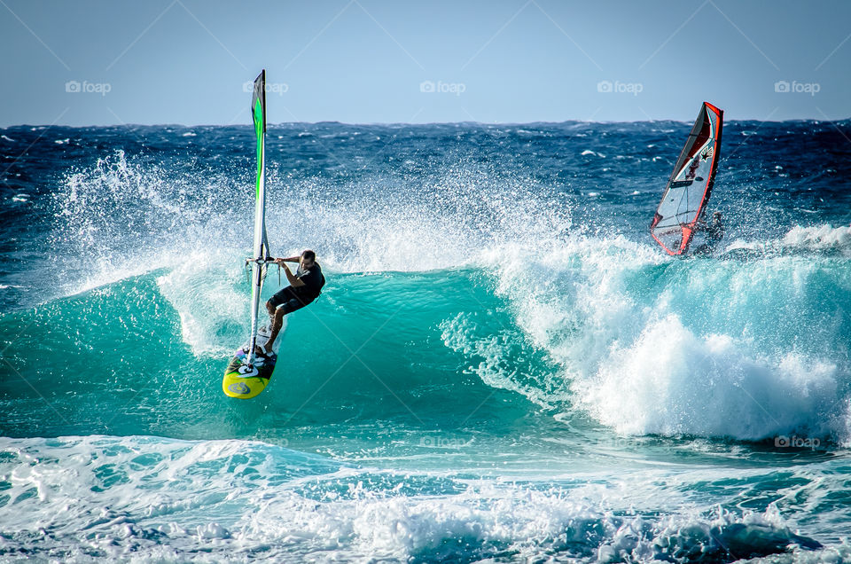 surfing on Maui . Surfer having fun on the waves on Maui