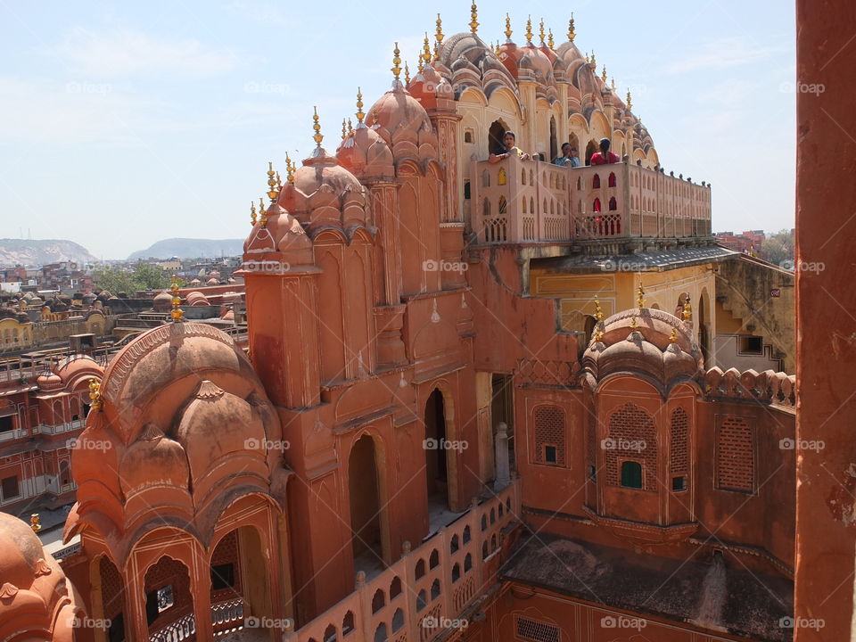 Hawa Mahal is a palace in Jaipur, India. It is constructed of red and pink sandstone. The palace sits on the edge of the City Palace, Jaipur, and extends to the zenana, or women's chambers. Hawa Mahal, built in 1799 by Maharaja Sawai Pratap Singh.