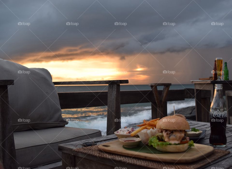 Burger sunset at the beach . Stunning  sunset at the "Mango Bay Resort" Restaurant on Phu Quoc Island / Vietnam. 