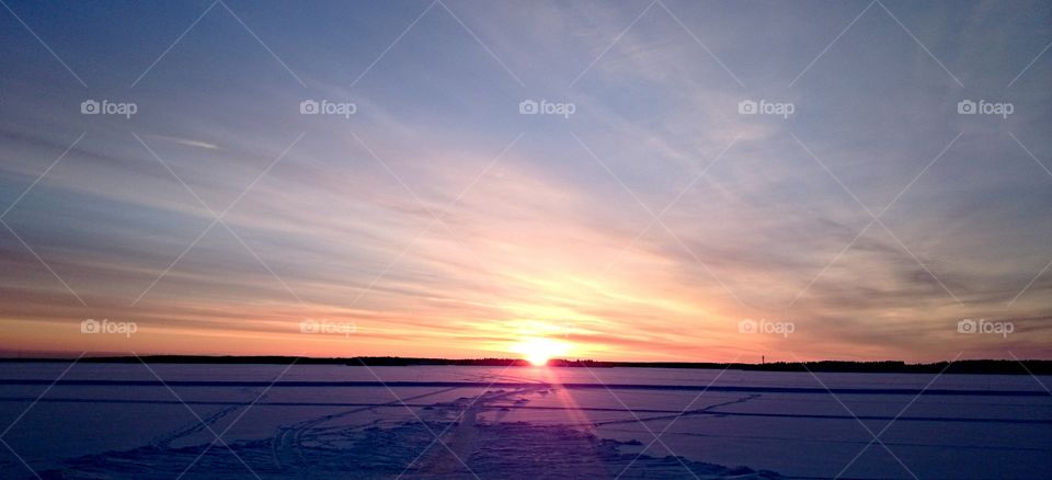 Northern cold sky. Cold sun in the north