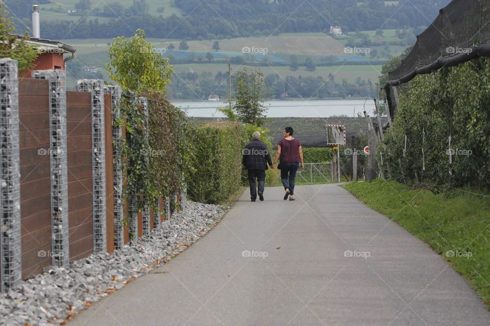 Hand In Hand. Couple walking holding hands