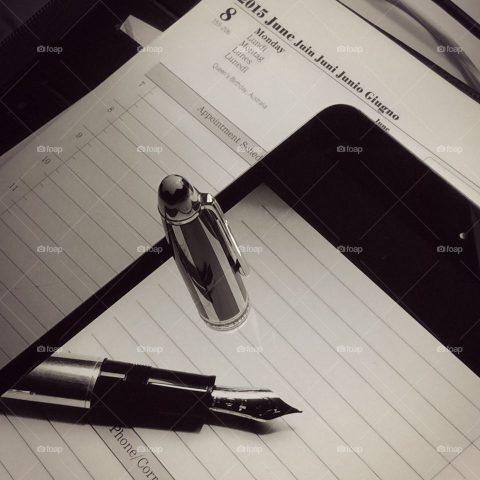 Fountain pen on tablet diary
