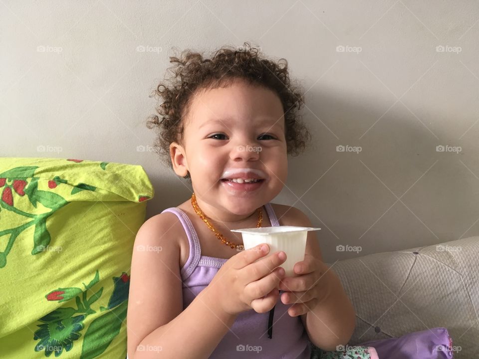 Small child drinking milk