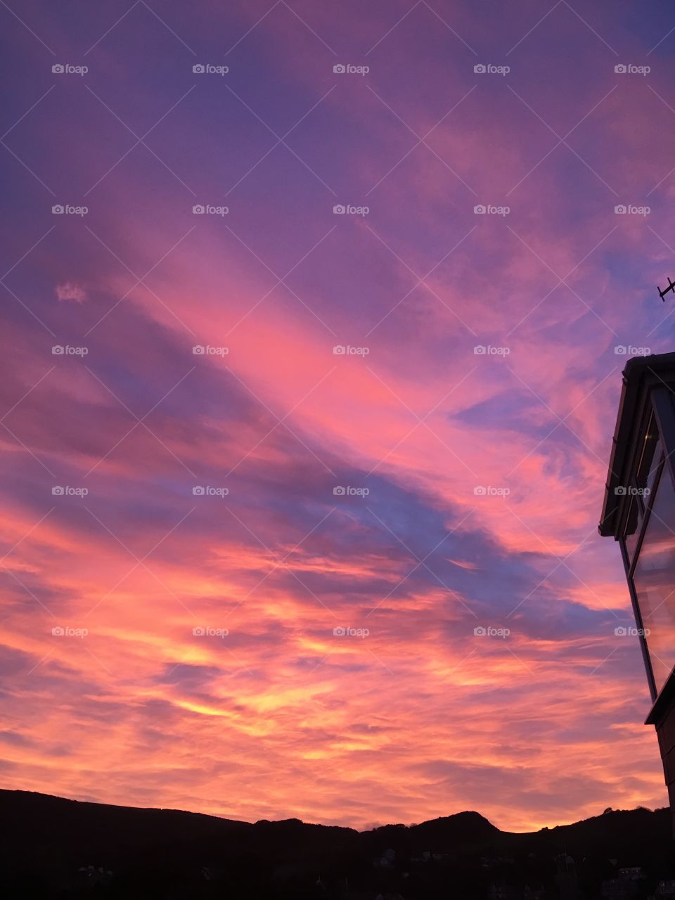 Red sky at night, Ilfracombe town in North Devon is ready for another day of beauty. The variety of colours, patterns and reflection in the window is amazing. 