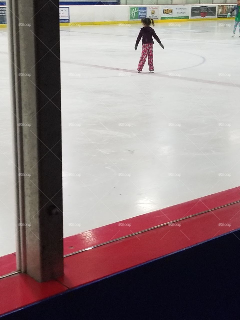 small child ice skating