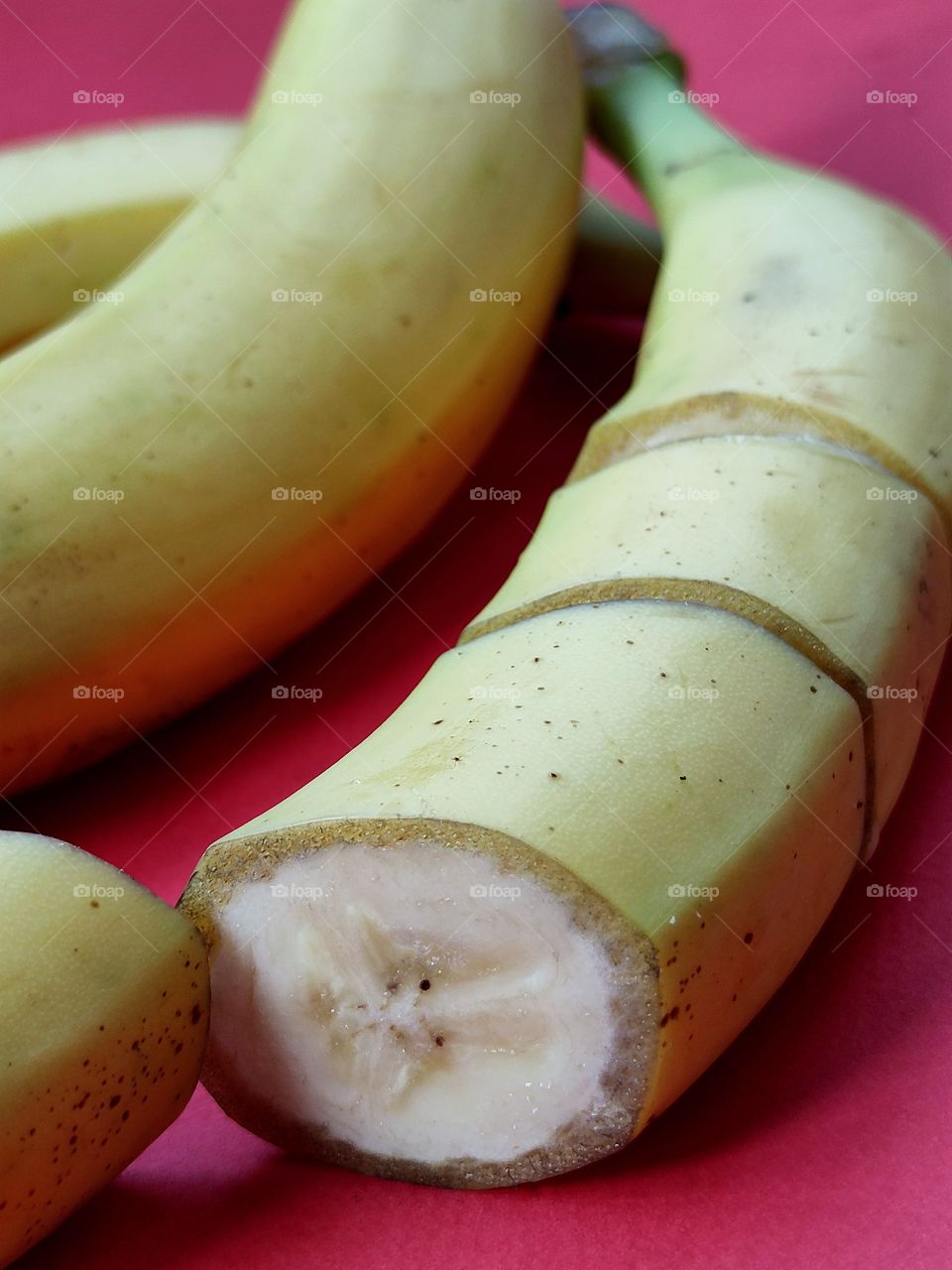 sliced ​​banana. red background