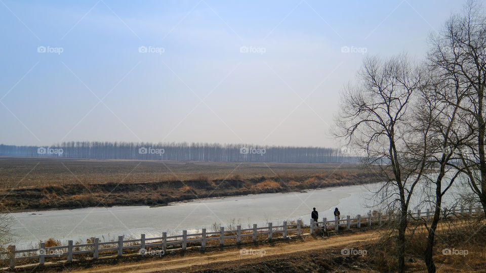 the ice on the river is melting