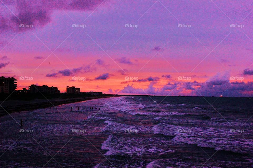 Scenic view of beach at sunset