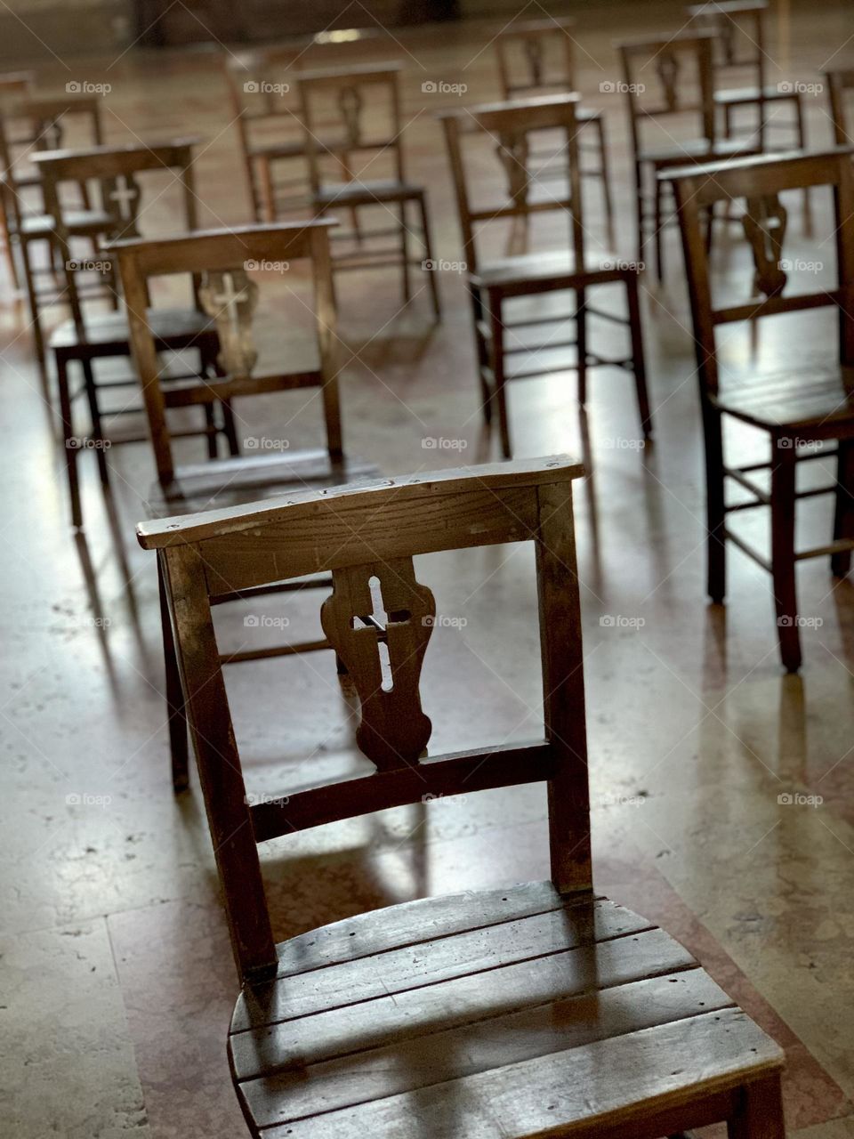 Old vintage wood church cathedral chairs inside a cathedral