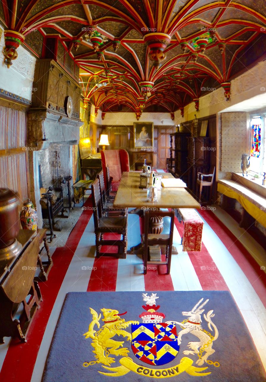 Bunratty castle  dining room . Bunratty castle formal dining room with striped carpet and crest 