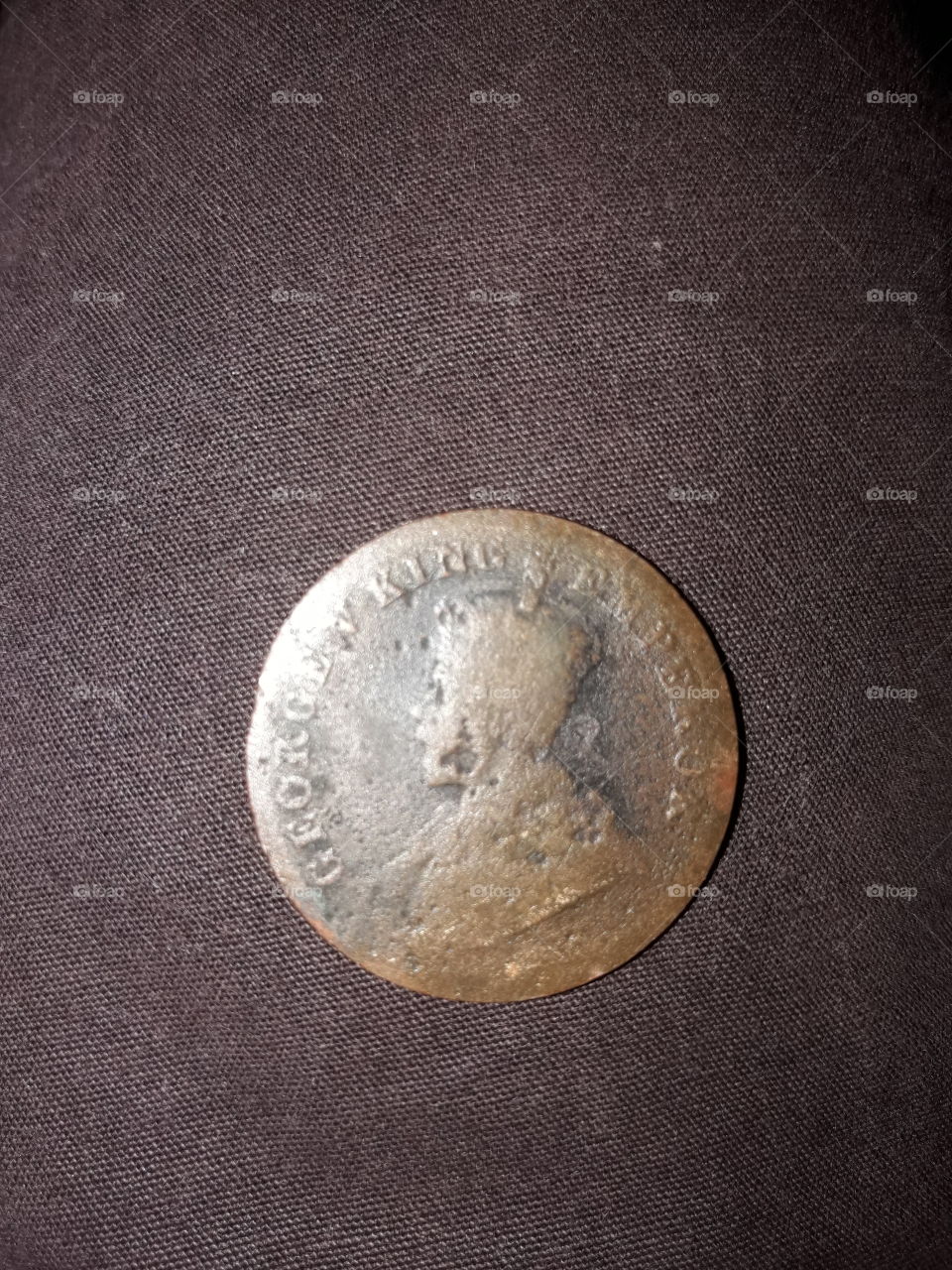 This  coin is veri old, it is 100years old, this coin is launching, 1917, geroge v king emperar, india and brietish kingGeorge V (George Frederick Ernest Albert; 3 June 1865 – 20 January 1936) was King of the United Kingdom and the British Dominions, and Emperor of India, from 6 May 1910 until his death in 1936.

He was the second son of the Prince and Princess of Wales (later King Edward VII and Queen Alexandra), and grandson of the then reigning British monarch, Queen Victoria. From the time of his birth, he was third in the line of succession behind his father and his own elder brother, Prince Albert Victor. From 1877 to 1891, George served in the Royal Navy, until the unexpected death of his elder brother in early 1892 put him directly in line for the throne. On the death of his grandmother in 1901, George's father became King-Emperor of the British Empire, and George was created Prince of Wales. He succeeded his father in 1910. He was the only Emperor of India to be present at his own Delhi Durbar.

His reign saw the rise of socialism, communism, fascism, Irish republicanism, and the Indian independence movement, all of which radically changed the political landscape. The Parliament Act 1911 established the supremacy of the elected British House of Commons over the unelected House of Lords. As a result of the First World War (1914–1918), the empires of his first cousins Tsar Nicholas II of Russia and Kaiser Wilhelm II of Germany fell, while the British Empire expanded to its greatest effective extent. In 1917, George became the first monarch of the House of Windsor, which he renamed from the House of Saxe-Coburg and Gotha as a result of anti-German public sentiment. In 1924 he appointed the first Labourministry and in 1931 the Statute of Westminster recognised the dominions of the Empire as separate, independent states within the Commonwealth of Nations. He had smoking-related health problems throughout much of his later reign and at his death was succeeded