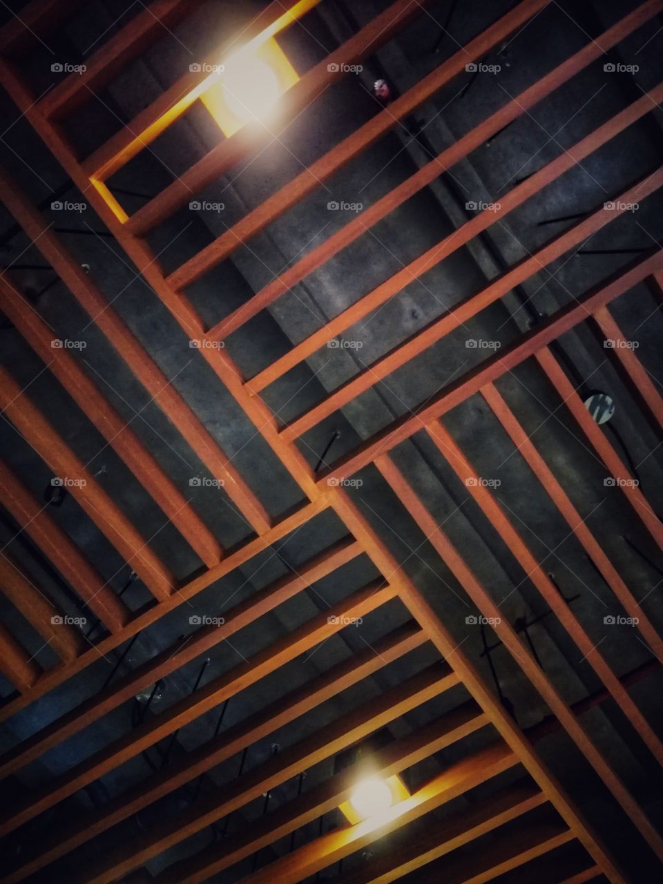Artistic ceiling design with the use of wood.