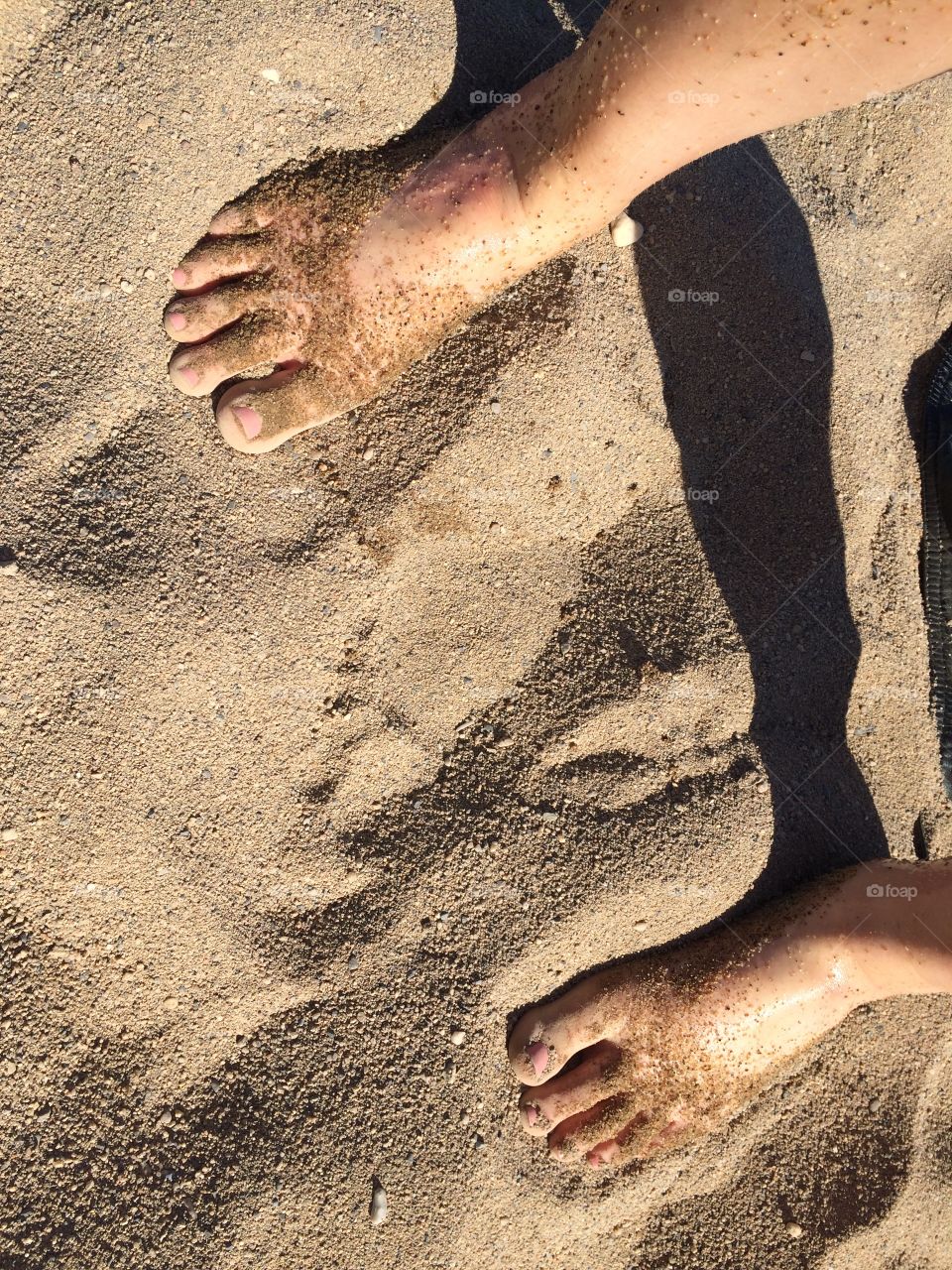 Feet on sand