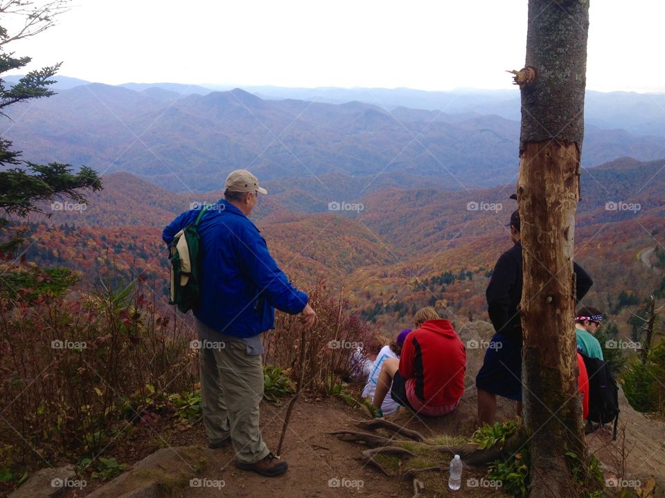 End of the trail view. Hikers gathered at the top of the  trail to take in the fall mountain view. 