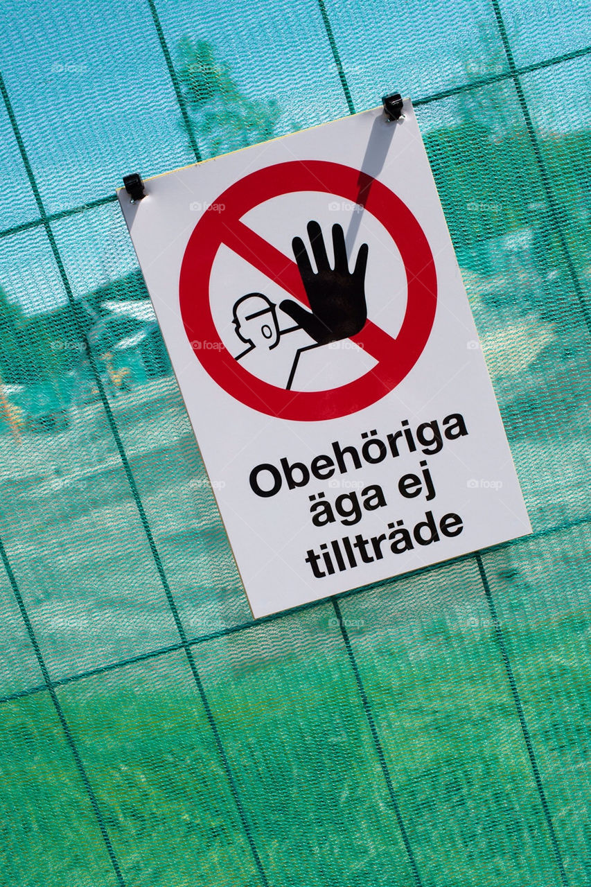 Sign that says "No trespassing for unauthorized persons" in Swedish