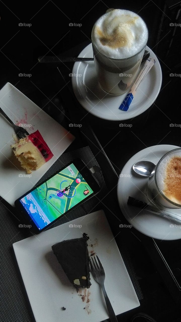 Caffee and cake in cafe and PokemonGo