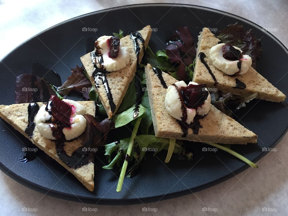 Goat cheesy deliciousness . Goat cheese and beets on flatbread with balsamic glaze