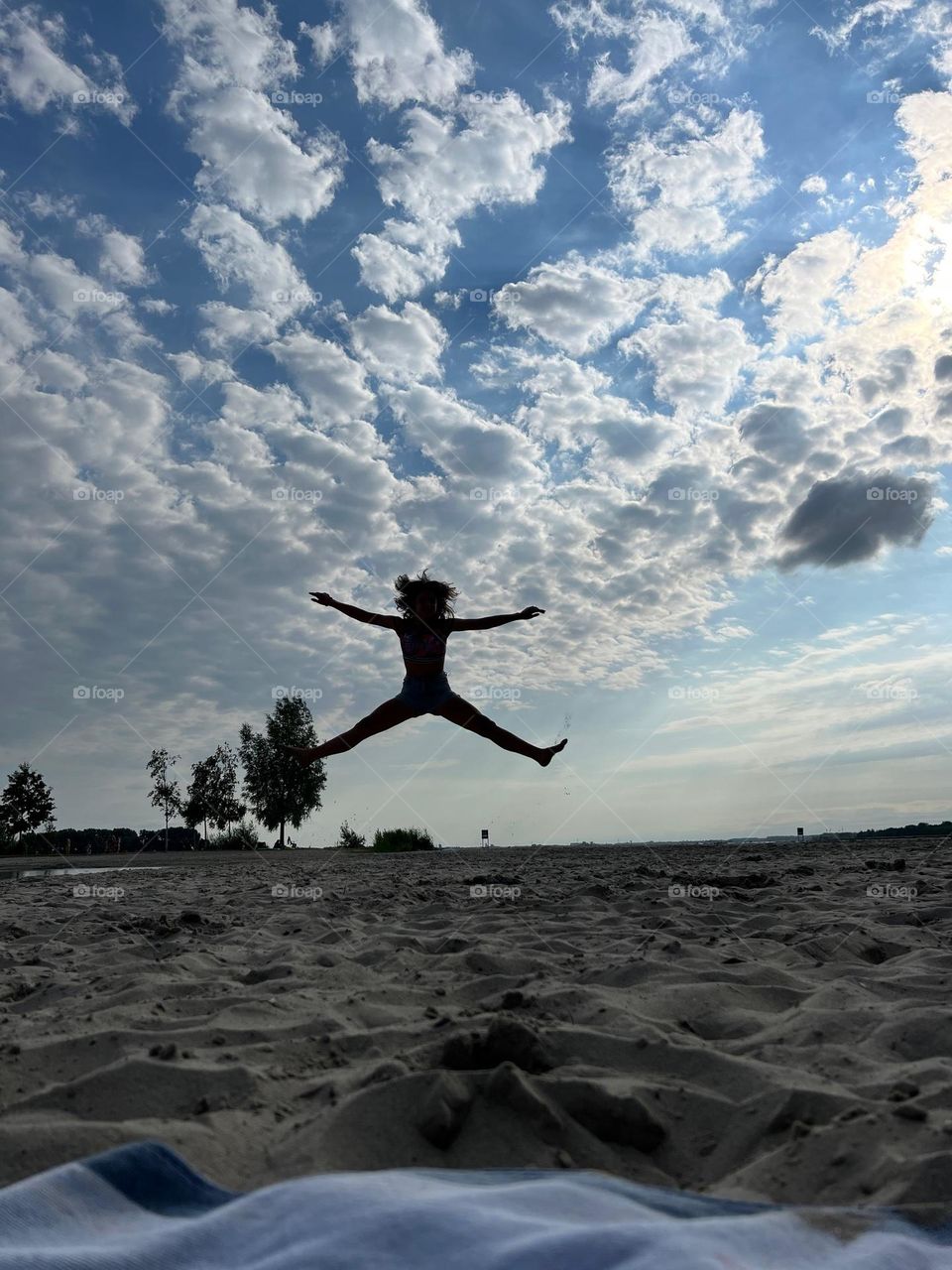 A happy jump on the beach