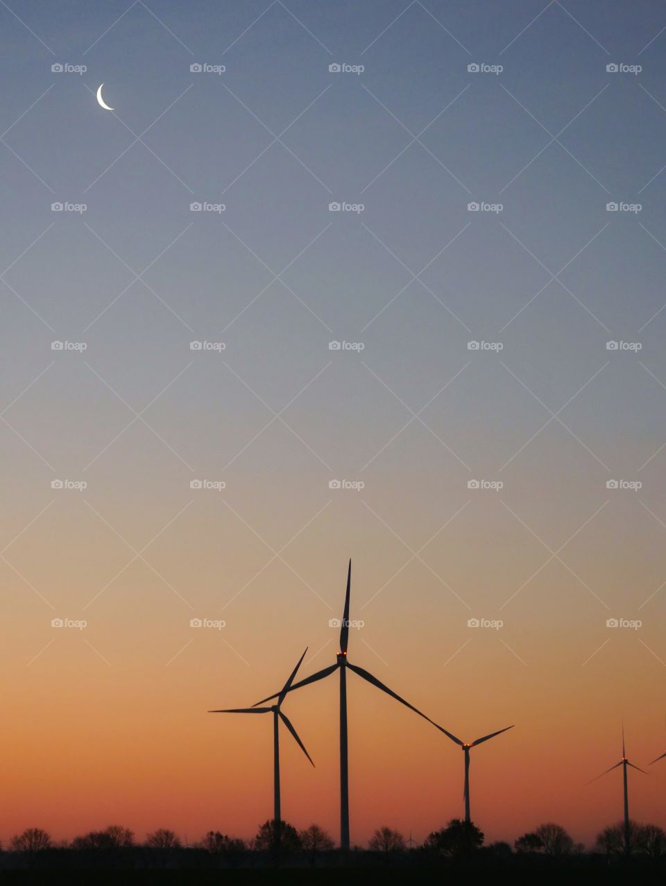 Silhouettes of wind turbines