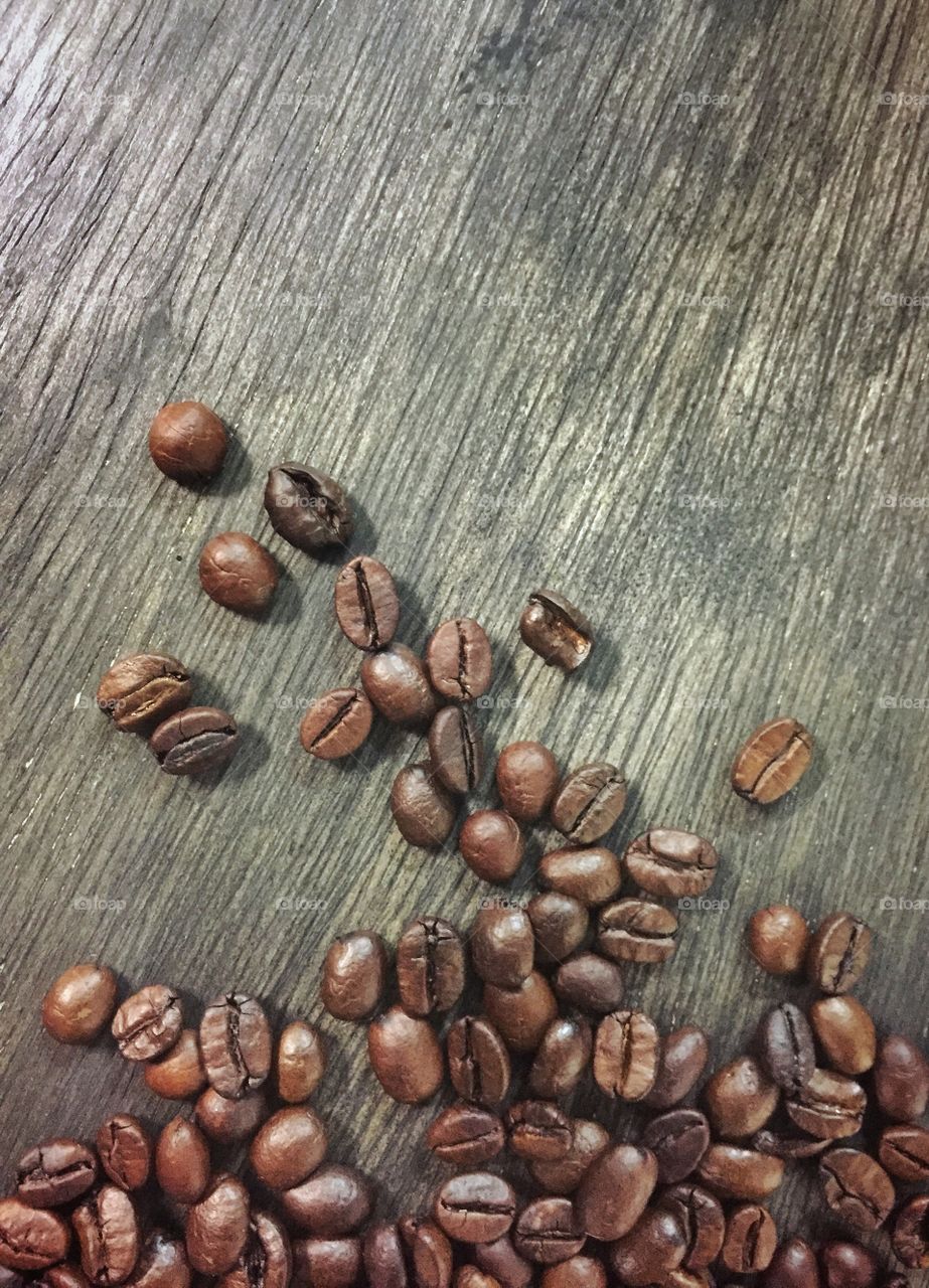 Close up of roasted coffee beans on wood