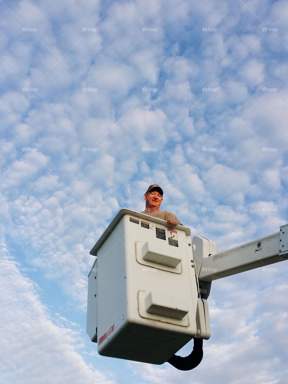 My Husband in a Service Bucket Raised Up Smiling From the Ground Up