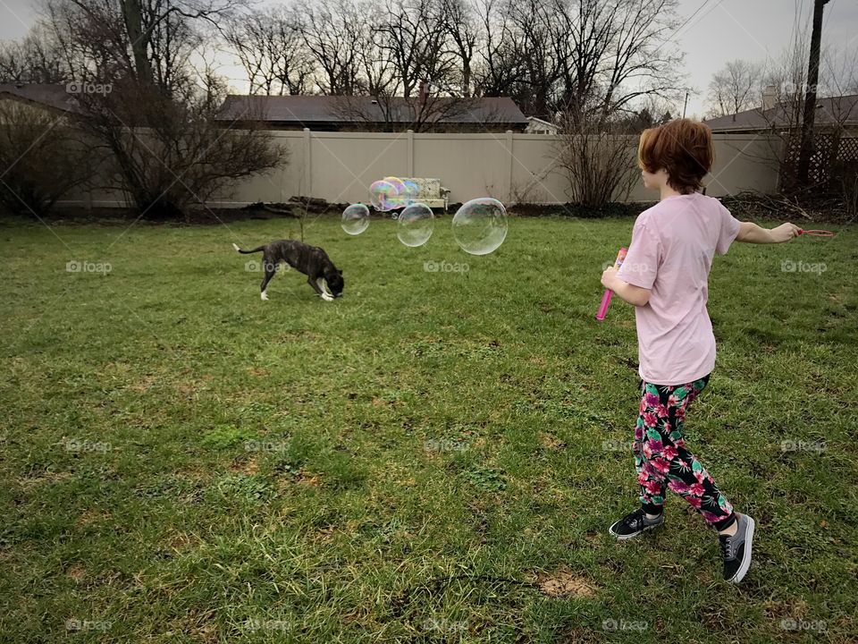 Daughter, dog, and bubbles