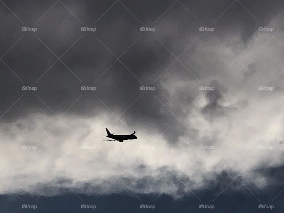 Beautiful flying airplane cross the sky