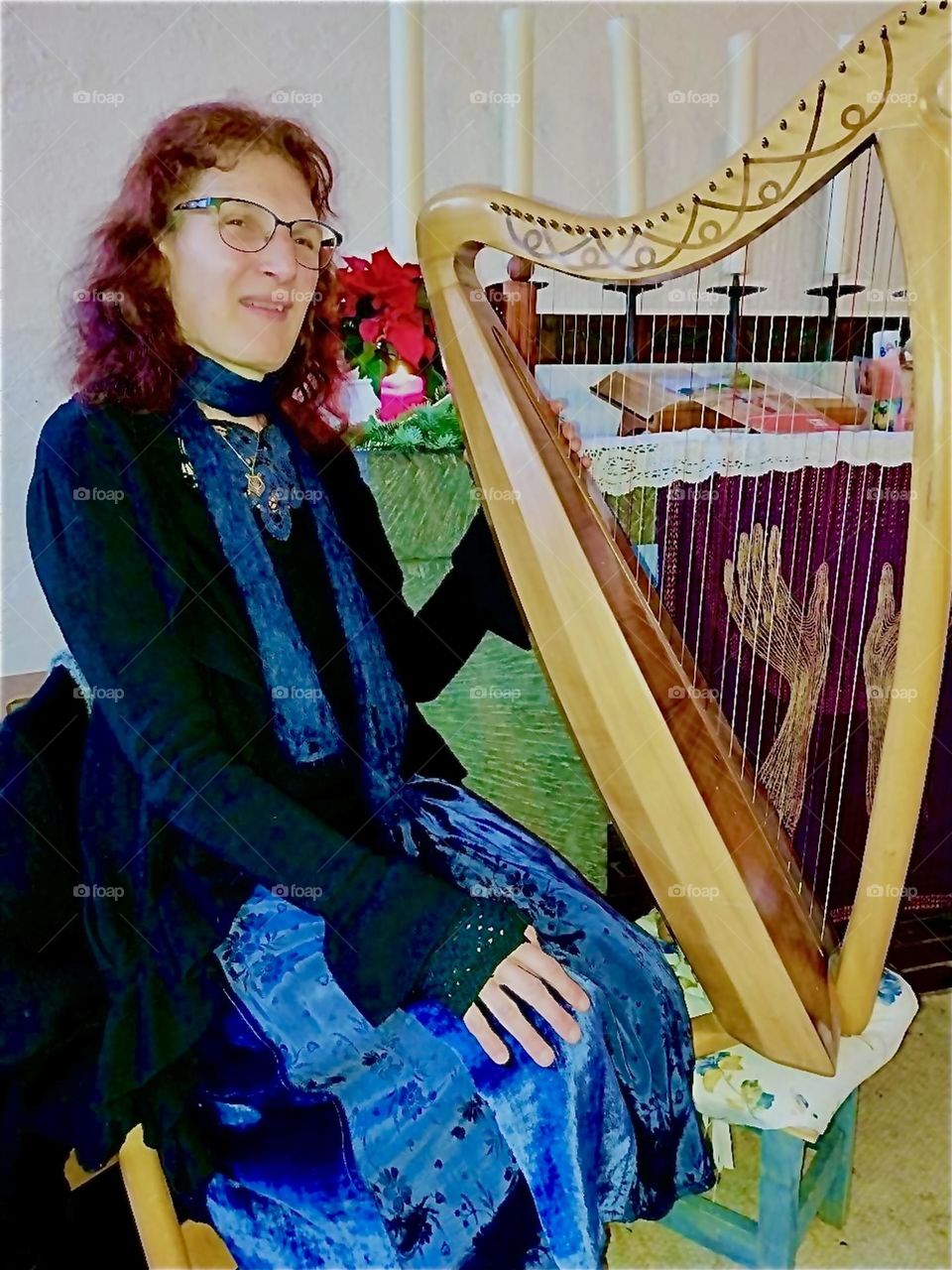 This lady plays the harp, the most elusive instrument known to man or perhaps to the angels as it is associated with the heavens. She is a singer songwriter and accompanies herself appearing in churches around “Bavaria”. 2023. Hypnotic Productions