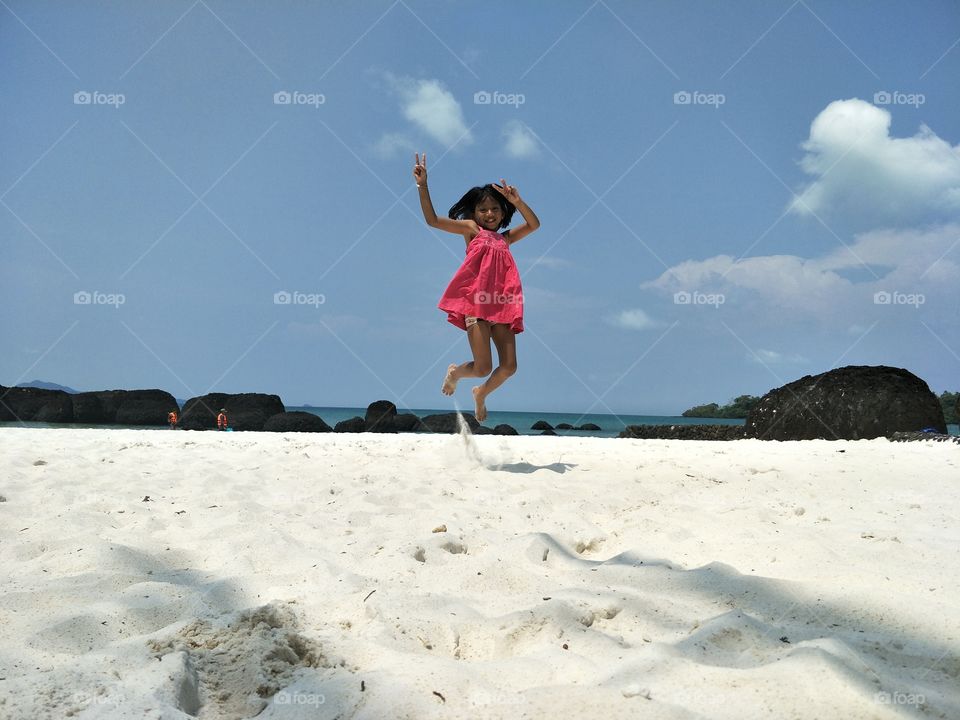 fun happy girl kid child at white sand beach summer
