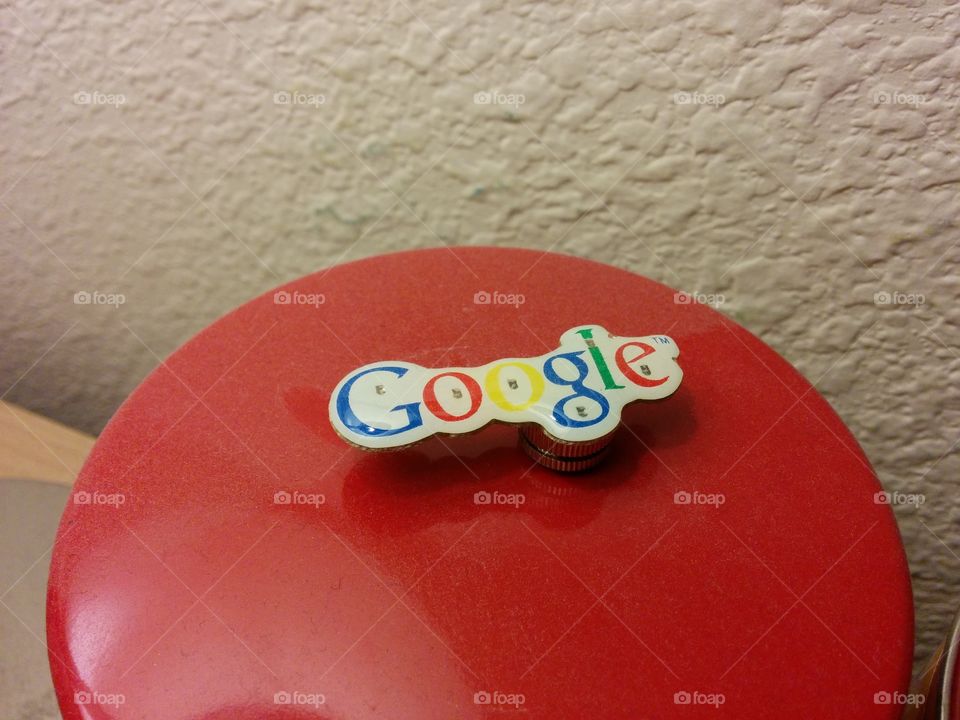 Light up Google!. This magnetic pin was free at a Google event last year with UCF. It not remains stuck to my metal tin.