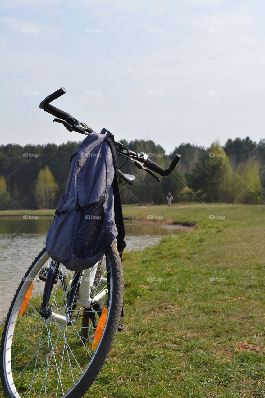 bike on a lake shore beautiful spring landscape blue sky background