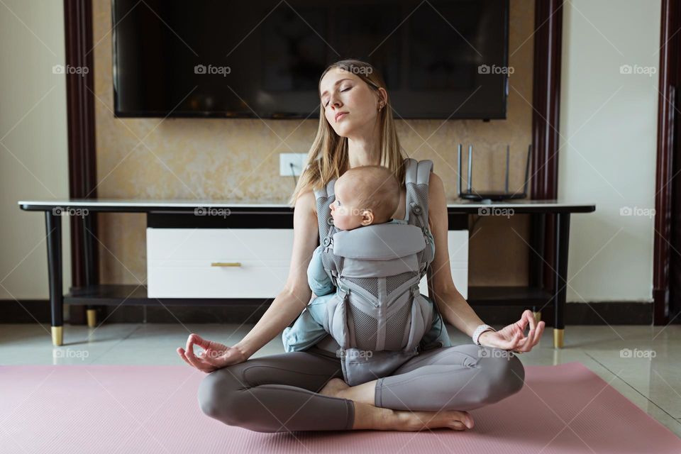 Mother meditating with baby 