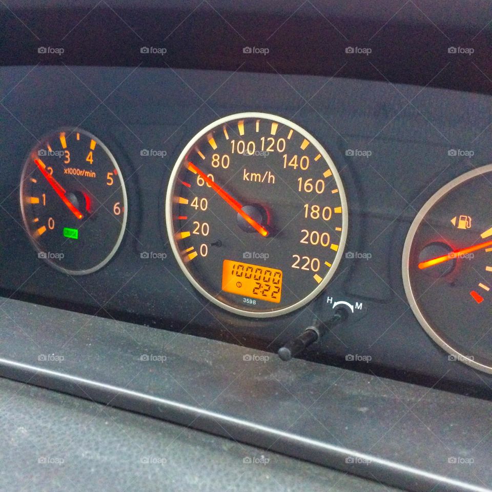 Speedometer of a car with a mileage indicator that has just reached 100000.