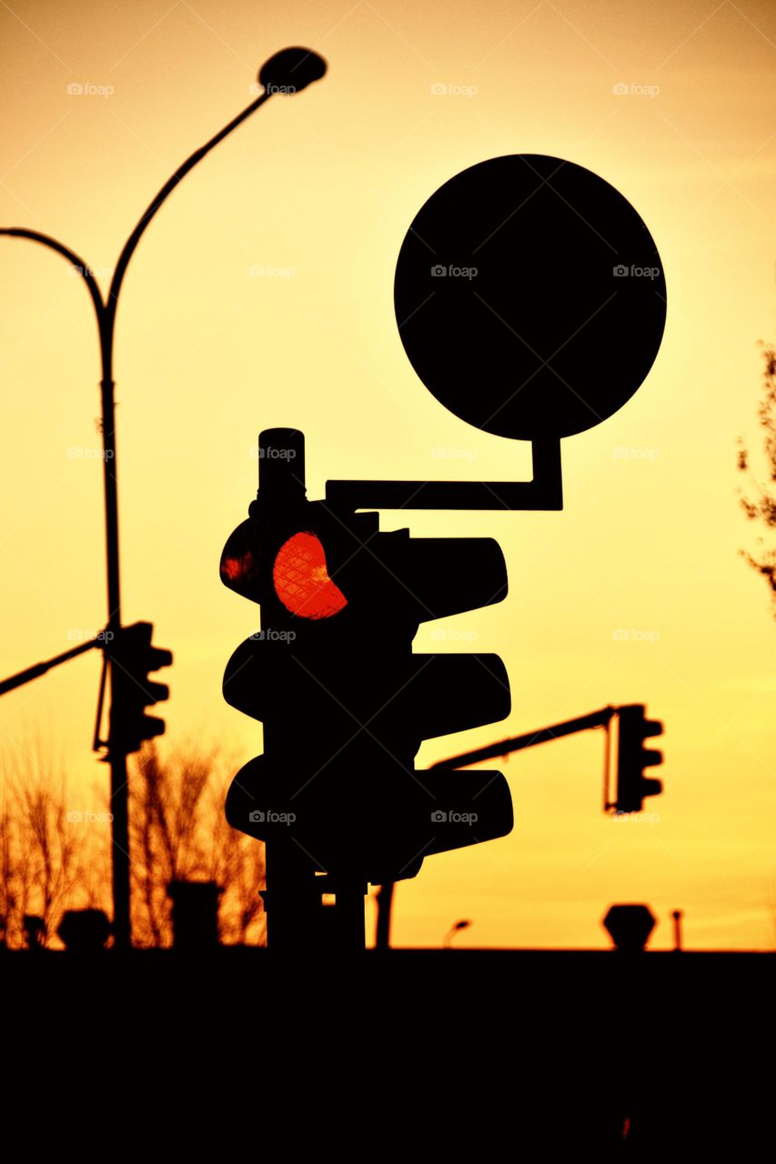 Traffic light at sunset