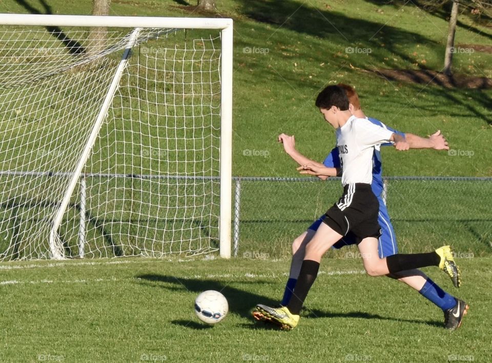 Soccer player trying to make a goal 