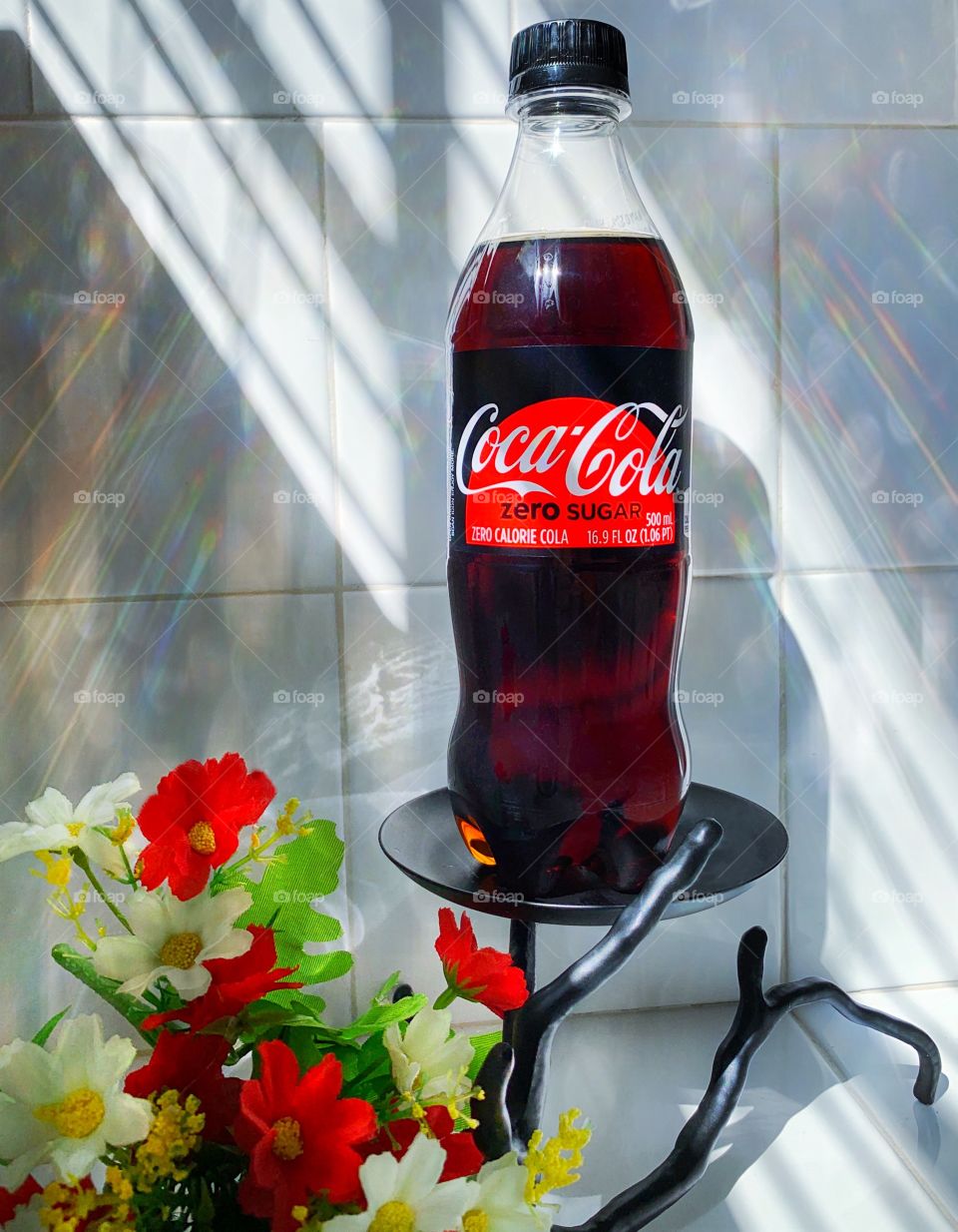 The glow of a sunlit delicious Coca Cola beverage.