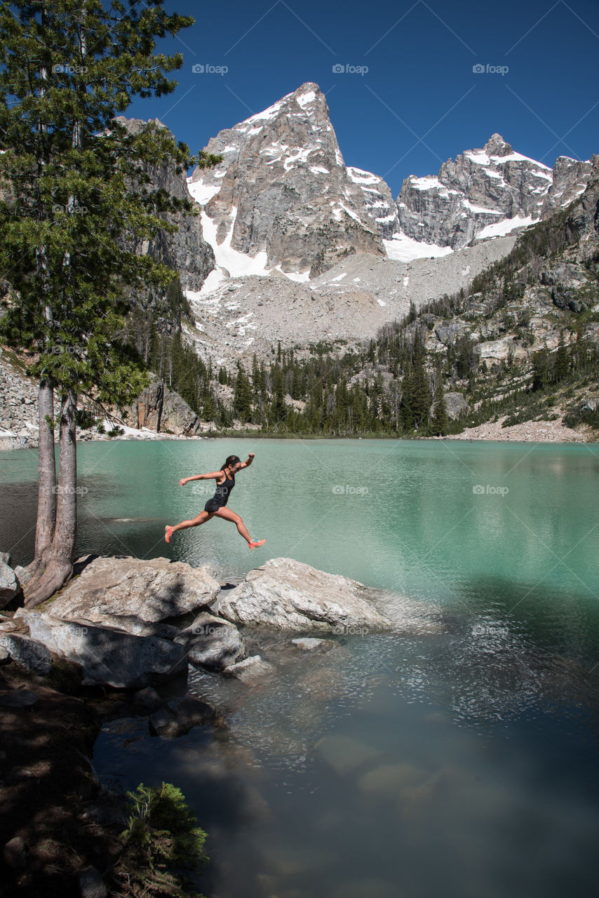 Under the vast Grand Teton mountain top there is a beautiful glacier fed lake that shines aqua on a gorgeous summer day